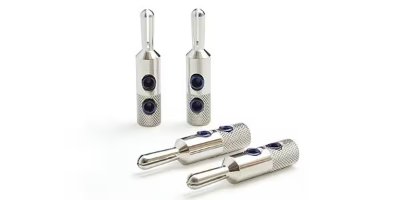 Four silver OYAIDE SRBN banana plugs on a white background, two standing and two lying down.