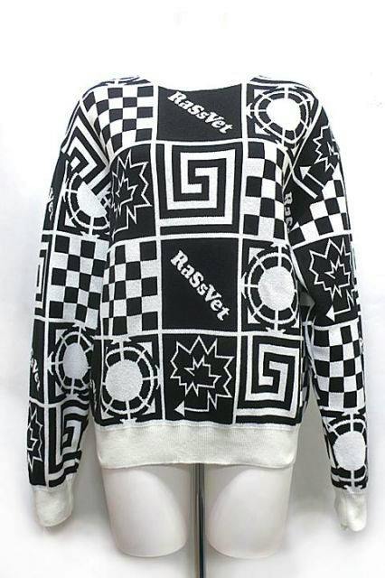 Front view of a black-and-white patterned PACCBET wool top on a mannequin.