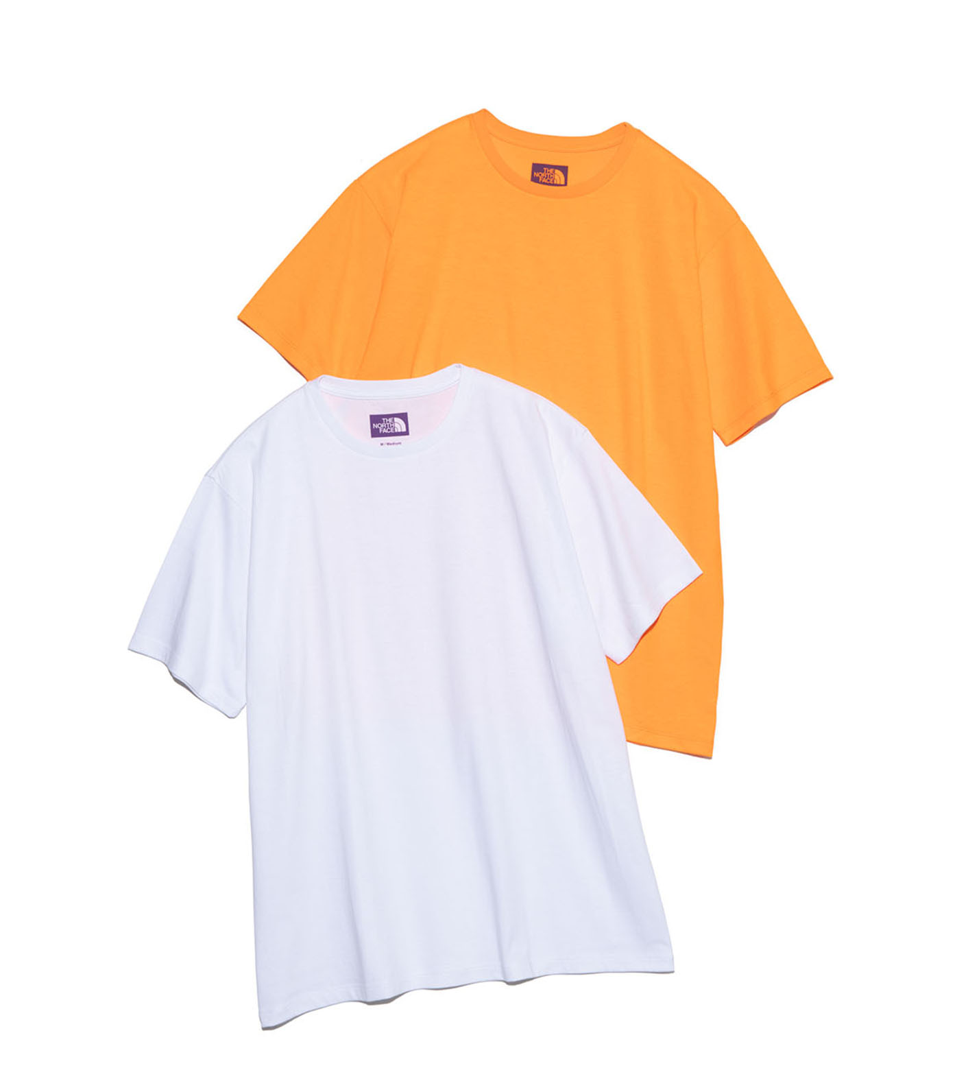 Two men's Pack Field Tee shirts (white and orange) laid flat on a white background.