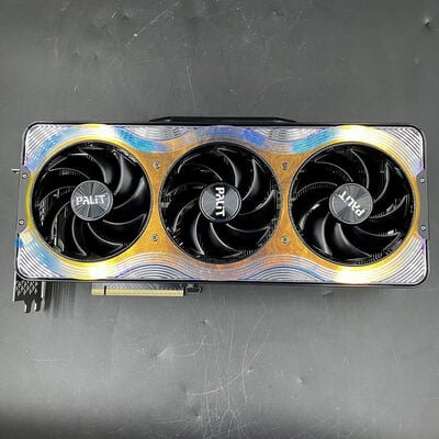 Front view of the Palit RTX5080 GameRock graphics card showing three cooling fans and the PCIe connector.