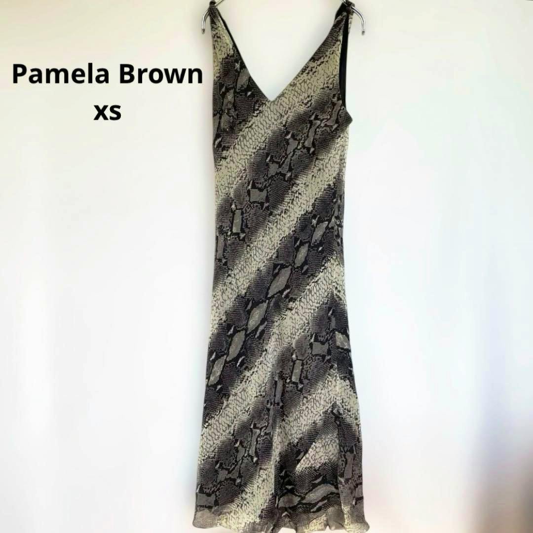 A Pamela Brown python-pattern silk camisole dress hanging on a hanger against a white background.
