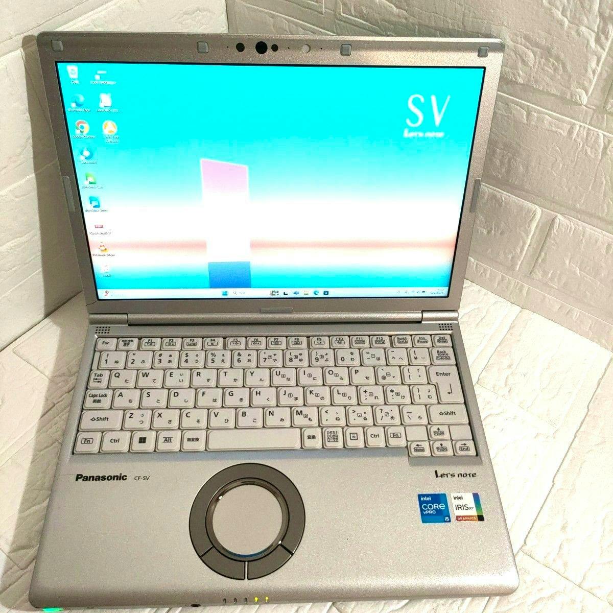 Open silver Panasonic Let's note CF‑SV laptop showing its screen, keyboard, and circular touchpad.