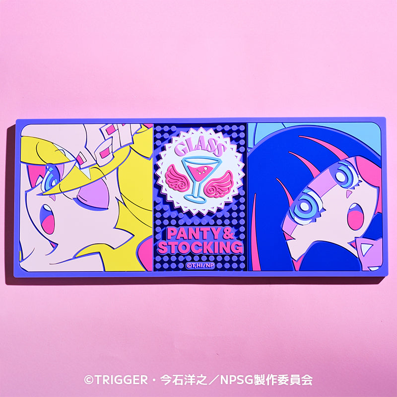 Rectangular rubber counter mat showing colorful Panty & Stocking character illustrations with a central logo on a pink background.
