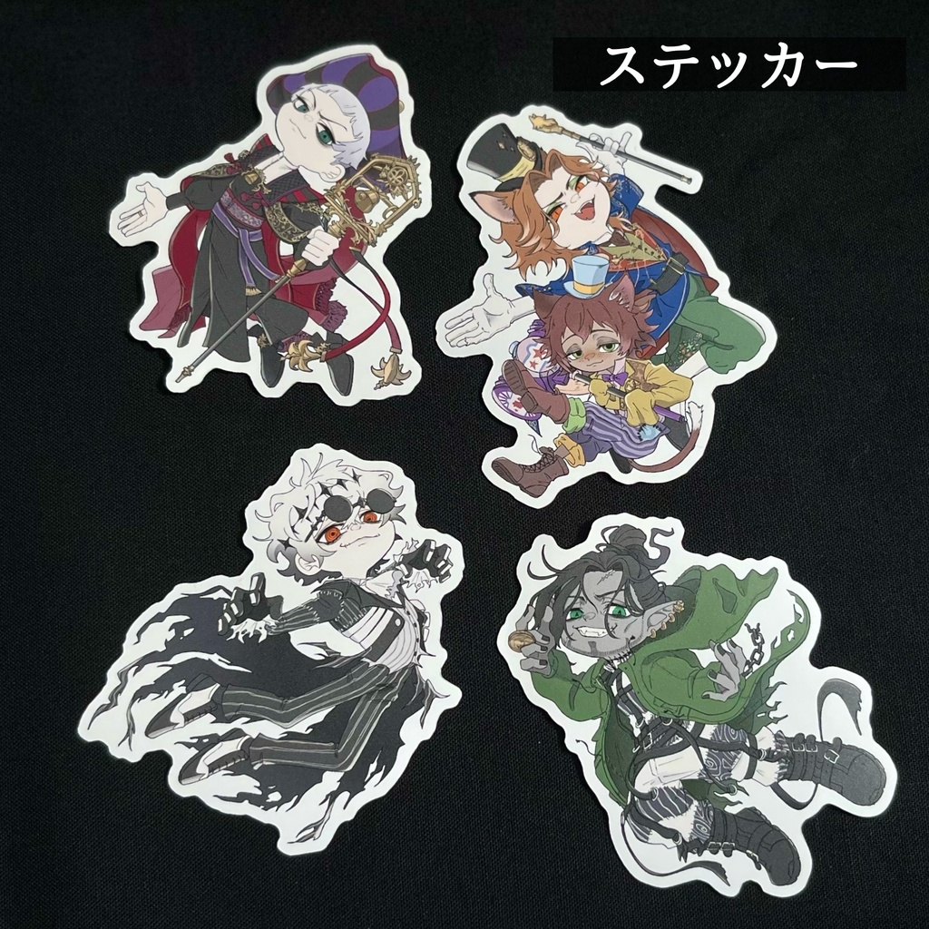 Four paper stickers showing chibi character illustrations arranged on a black background.