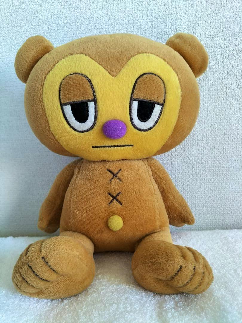 Front view of the パラッパラッパー スーパー ジャンボ ぬいぐるみ 貯金箱 plush showing the character's face and body.