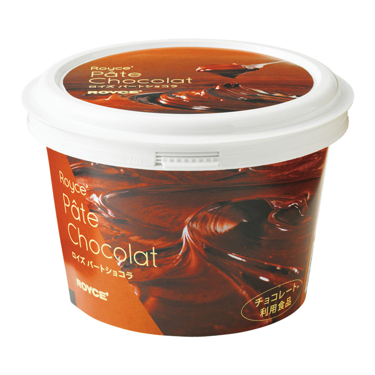 Plastic tub container of パートショコラ chocolate spread with a chocolate swirl label.