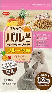 Packaged bag of Japanese Parwan rabbit food (fruit flavor, 1.2 kg) showing pellets, fruit images, and two rabbits on the front.
