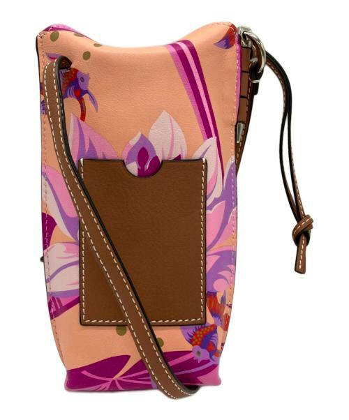 Paula Gate Pocket Bag waterlily in cow leather, front view showing brown pocket, floral print, and strap.