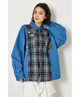 Model wearing the PEANUTS check-and-denim docking shirt jacket with a plaid front panel and blue denim sleeves.