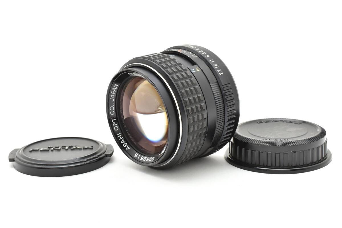A PENTAX SMC PENTAX-M 85mm F2 camera lens shown with front and rear caps on a white background.