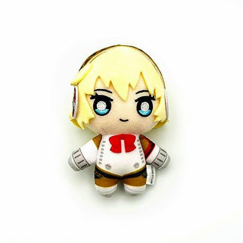 A P3R plush keychain of アイギス (Aegis) with blond hair, blue eyes, and a red bow, photographed on a white background.