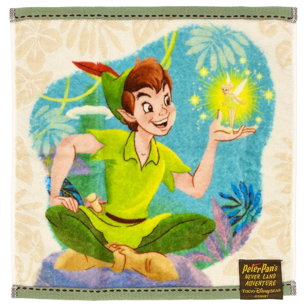 A face towel showing a printed illustration of Peter Pan holding Tinker Bell on a decorative background.