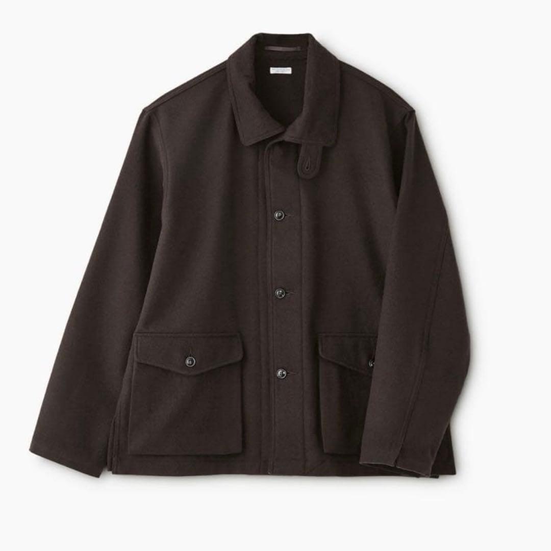 Front view of a men's wool jacket with button closure and two front flap pockets on a white background.