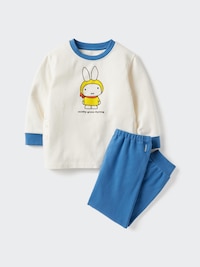 Flat-lay of a children's pajama set: a white long-sleeve top with a bunny character print and blue pants.