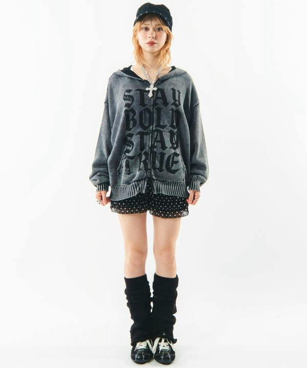 Front view of a model wearing a gray pigment logo knit zip hoodie.