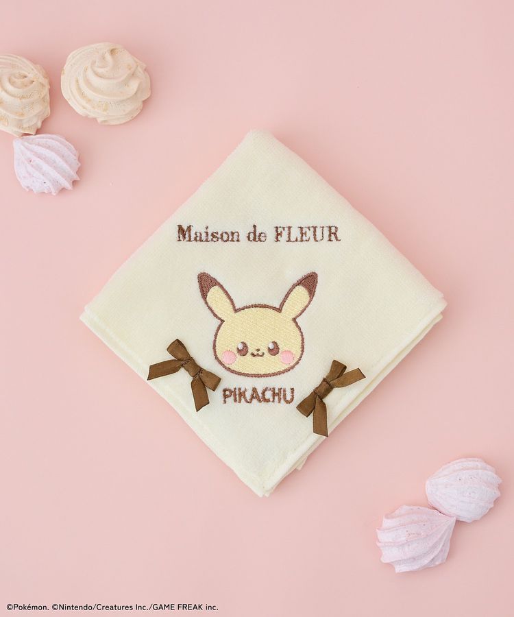 Cream-colored embroidered cotton handkerchief showing a Pikachu face, two brown bows, and the text 'Maison de FLEUR'.