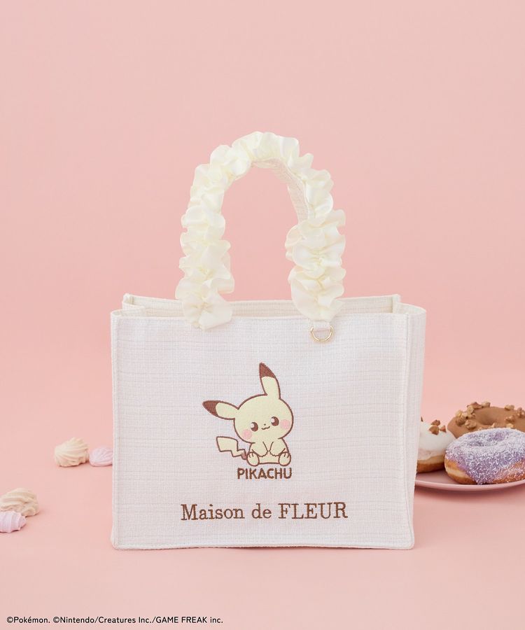 Cream-colored frill-handle tote bag with a Pikachu graphic and "Maison de FLEUR" text on the front.
