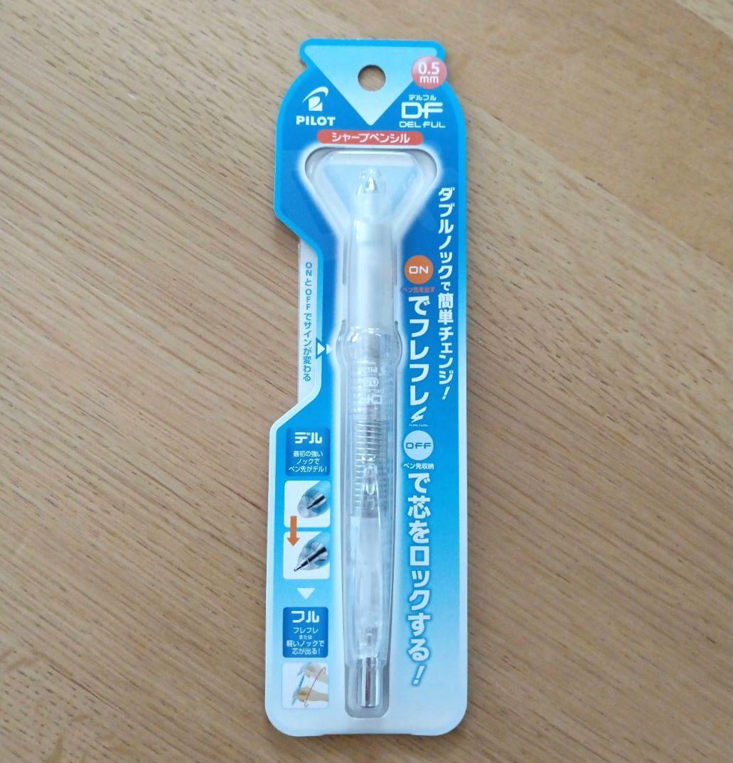 Sealed Pilot DELFUL 0.5mm mechanical pencil in blue blister packaging on a wooden surface.