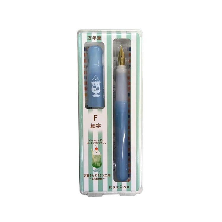Packaged Kakuno fountain pen (fine nib) in a clear plastic case showing a blue pen and matching cap.