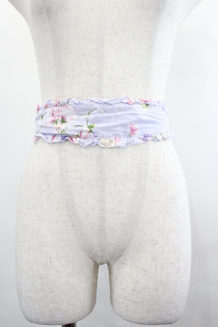 Front view of the lavender sash belt wrapped around a neutral dress form's waist.