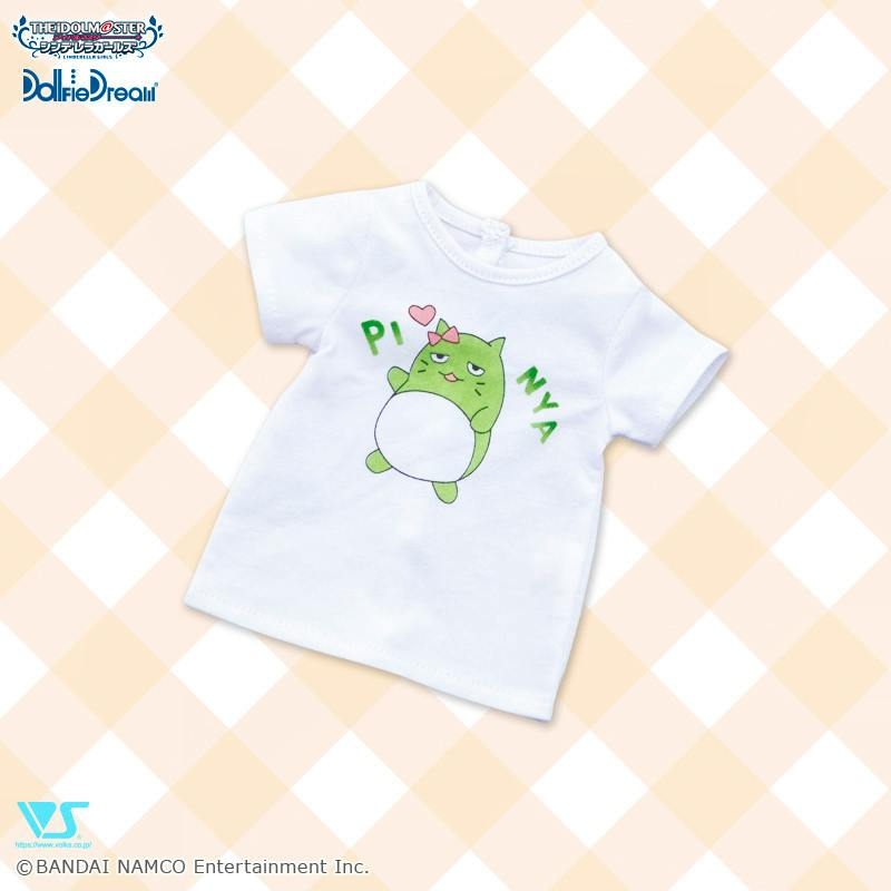 A white doll T‑shirt featuring a green ぴにゃこら太 character printed on the front.