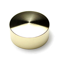 A round brass-colored bottle cap shown alone on a white background.