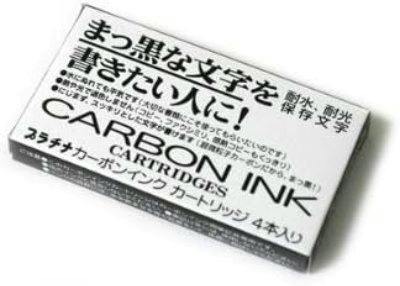 Rectangular box labeled 'CARBON INK' with Japanese text, showing packaged carbon ink cartridges.