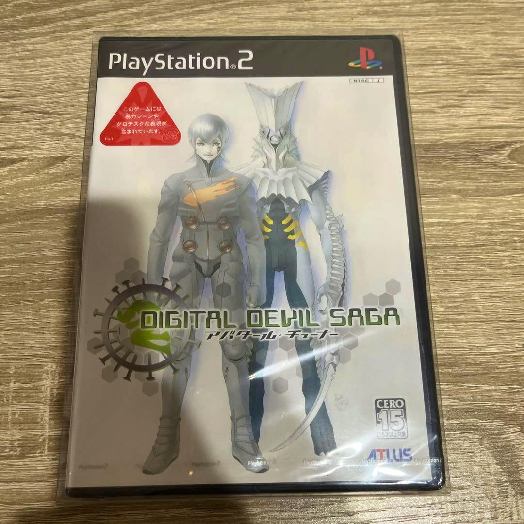Photo of the front of a PlayStation 2 game case for Digital Devil Saga (アバタールチューナー) shown sealed in shrink wrap.
