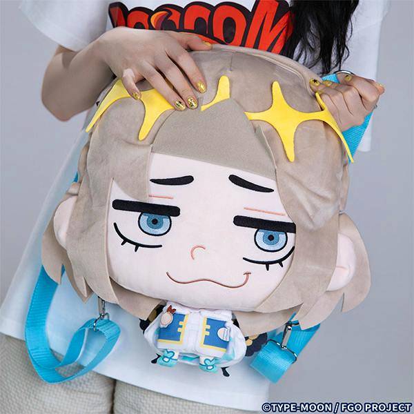Photo of a plush character-shaped backpack (gray-haired design) with blue shoulder straps being held in front of a person.