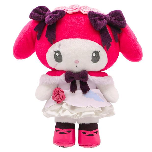 Front view of a small red-and-white plush toy wearing a dress with bows and rose decorations.