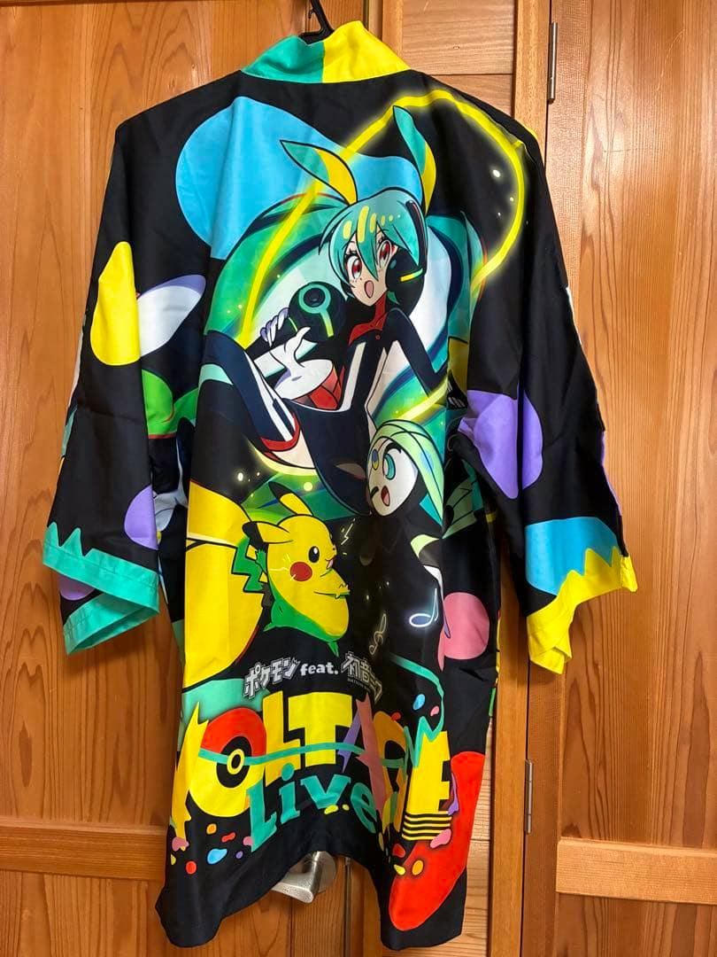 Back of a colorful Pokémon × Hatsune Miku live-themed happi coat showing Pikachu and Miku artwork hanging on a hanger.