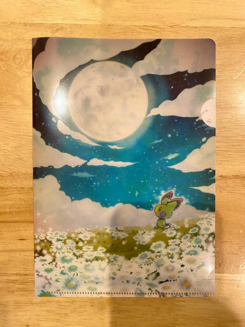 Front of the A5 mini file showing a moonlit sky, a field of white flowers, and a small Pokémon character.