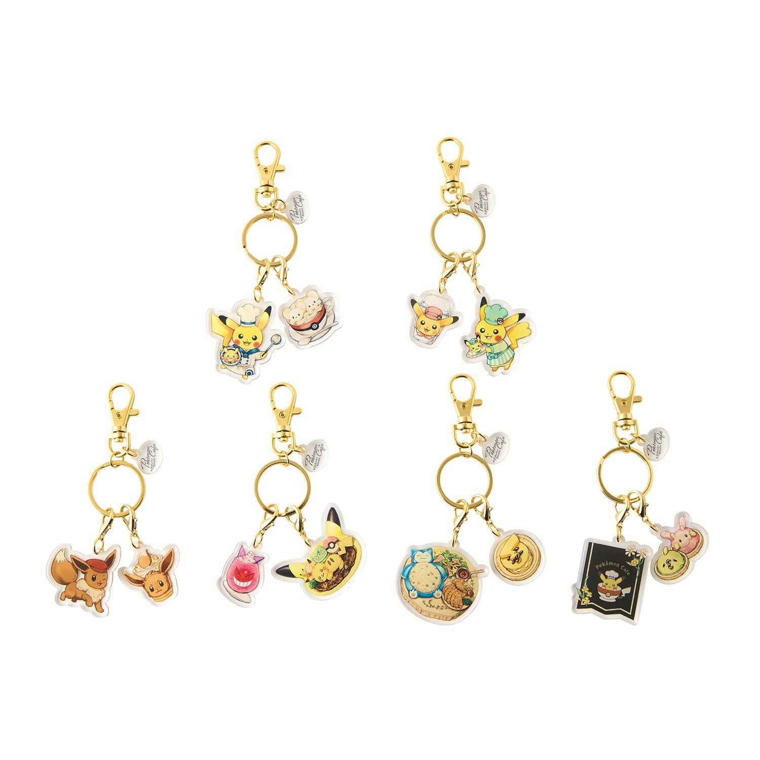 Multiple acrylic Pokémon Cafe & Pikachu Sweets keychain charms with gold rings and clasps shown on a white background.