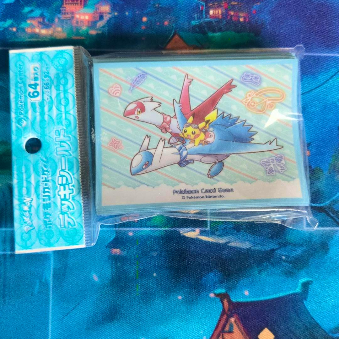 Sealed pack of Pokémon card sleeves (deck shields) showing Latias and Latios artwork in original plastic packaging.