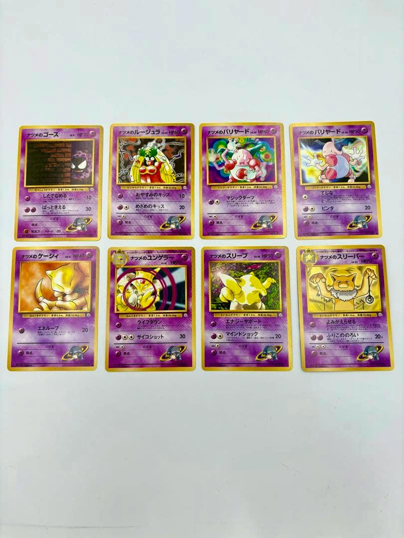 Eight Pokémon trading cards from Natsume’s (Sabrina) set shown face-up on a white background.