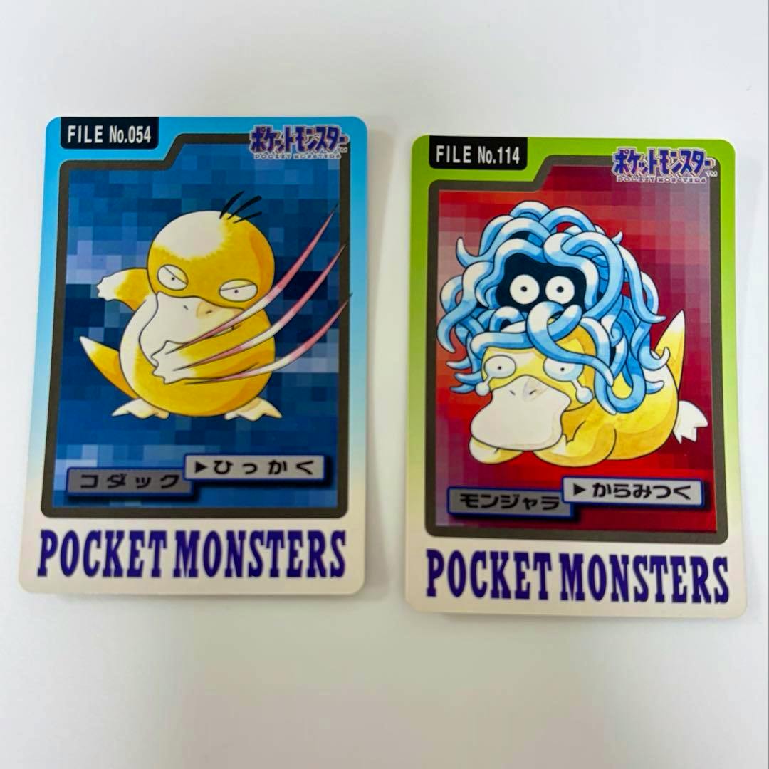 Fronts of two Pokémon Carddass photocards showing コダック on the left and モンジャラ on the right.
