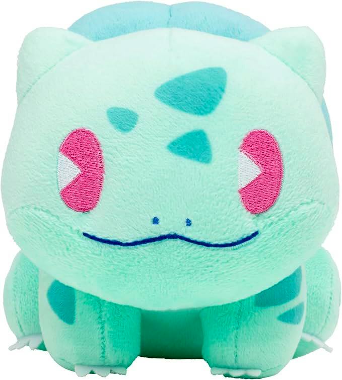 Front-facing light green Bulbasaur plush toy with embroidered pink eyes and a blue mouth.