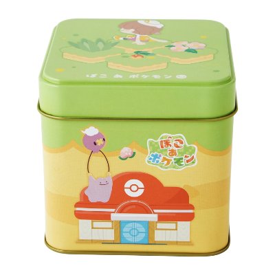 Square green and yellow metal tin decorated with Pokémon characters and a Poké Ball building illustration.