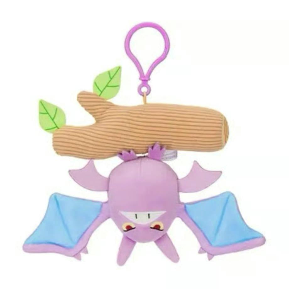 Crobat plush mascot keychain hanging upside down from a brown log with a purple clip on a white background.