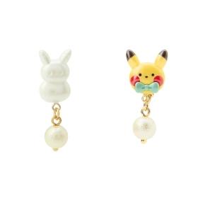 A mismatched pair of earrings showing a white snowman-shaped charm and a Pikachu ornament charm, each with a dangling round bead.
