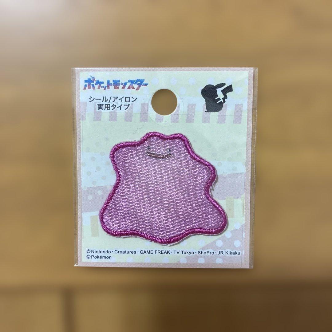 Packaged pink Metamon (Ditto) embroidered patch displayed on a backing card.