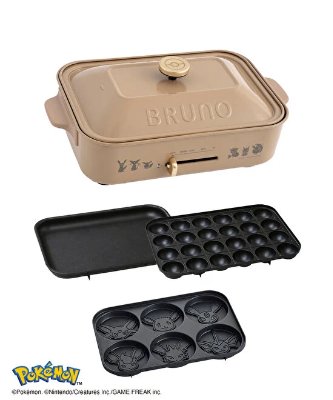 Beige BRUNO compact hot plate with lid and three interchangeable cooking plates, including a flat plate, a takoyaki plate, and a Pokémon face-molded plate.