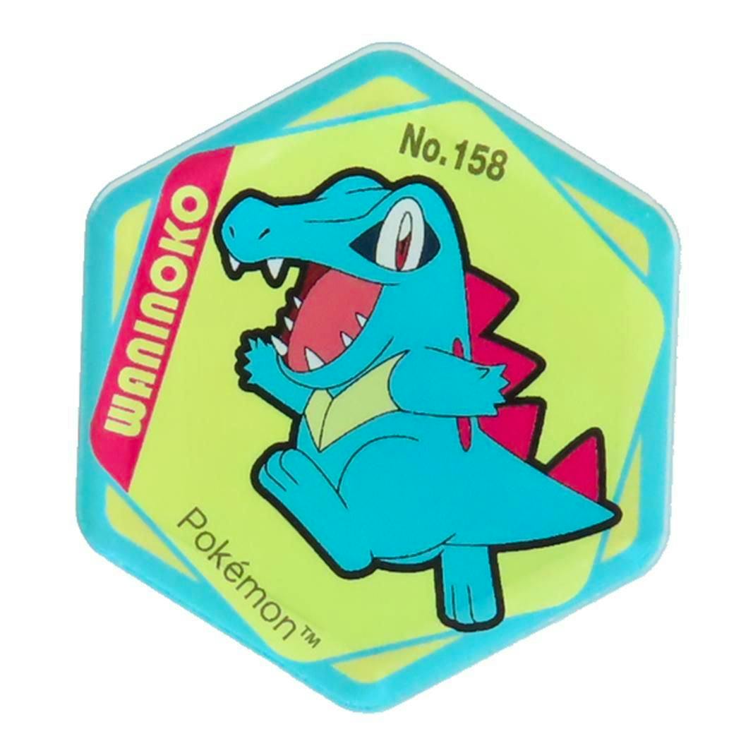 Hexagonal acrylic fridge magnet showing the Pokémon Waninoko (Totodile) illustration on a yellow background.