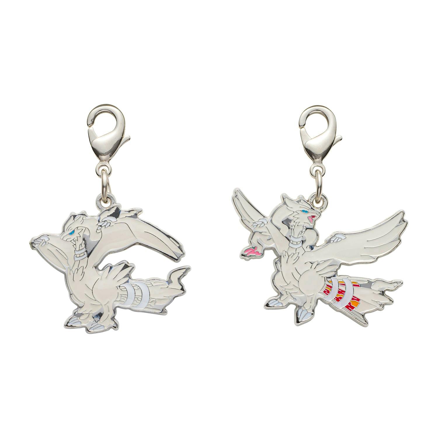 Close-up of two metal keychain charms with lobster clasp attachments showing white creature designs.