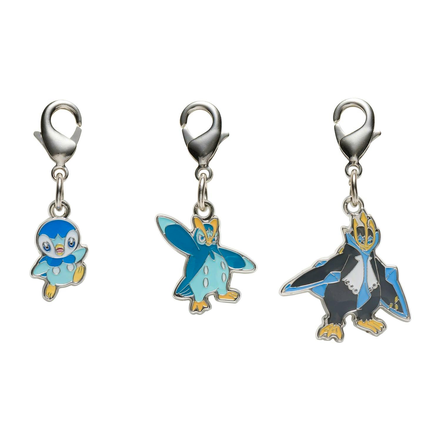 Three zinc-alloy metal keychain charms on lobster-clasp attachments shown against a white background.