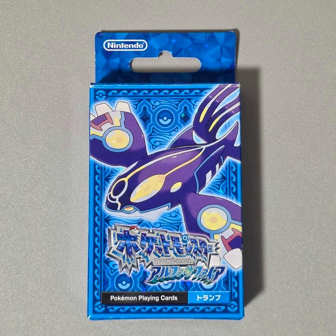 Front of the Pokémon Playing Cards (アルファサファイア) box showing a purple Pokémon illustration and a Nintendo logo.