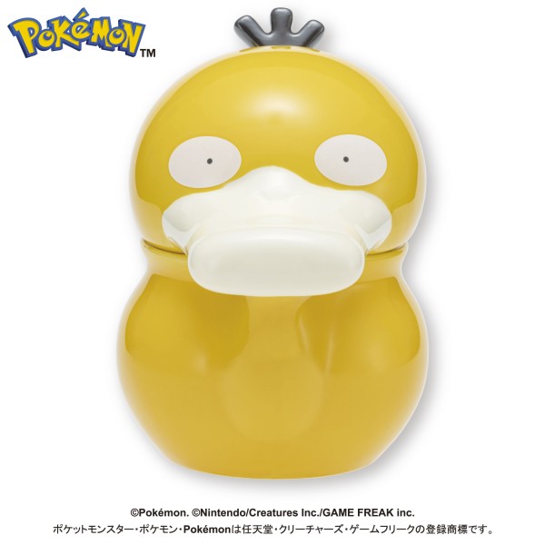 Front view of the Psyduck-shaped yellow porcelain teapot (watering-can style) on a white background.