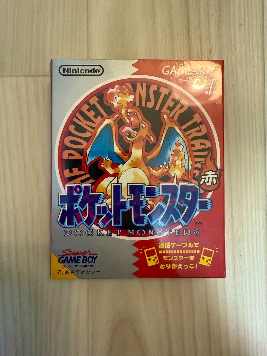 Front of the boxed Japanese Pocket Monsters (Red) Game Boy game showing Charizard artwork on the cover.