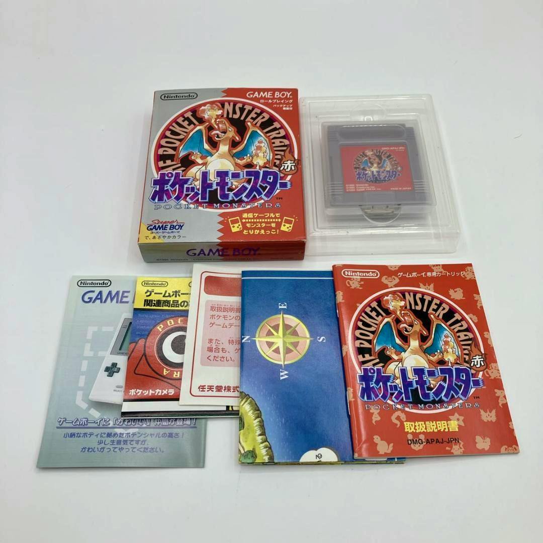 Photo of the Pocket Monsters (Pokémon) Red Game Boy game showing the game box, the cartridge in a plastic case, and the accompanying manuals and inserts.