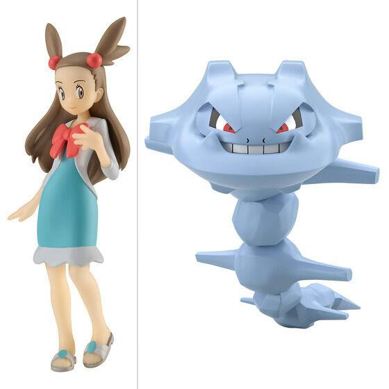 Two plastic figures of Mikan and Haganeil (Steelix) shown on a white background.